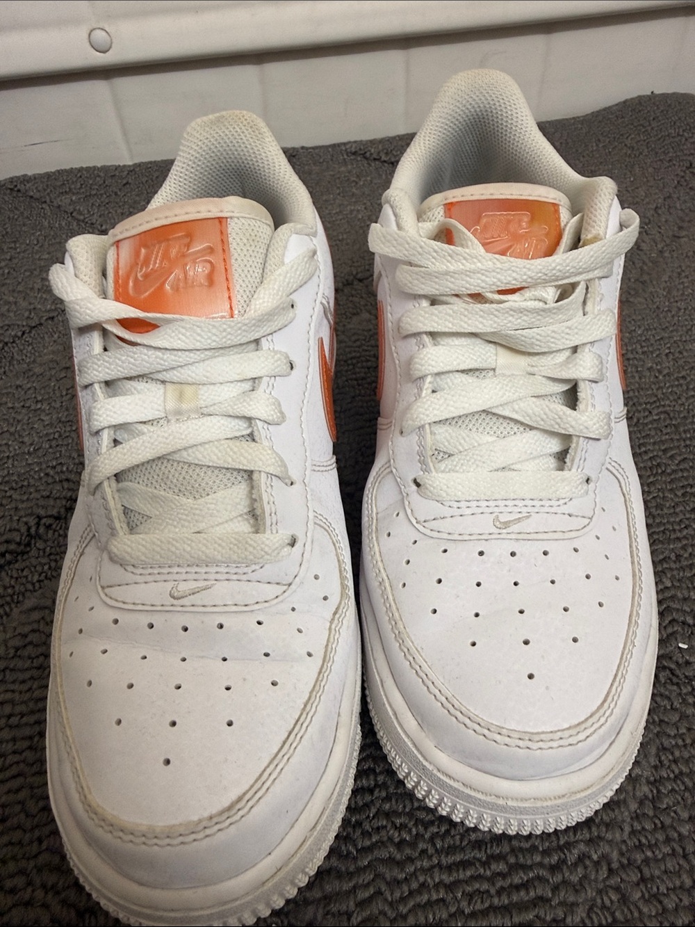 Nike White Low-Top Sneakers with Orange Accents